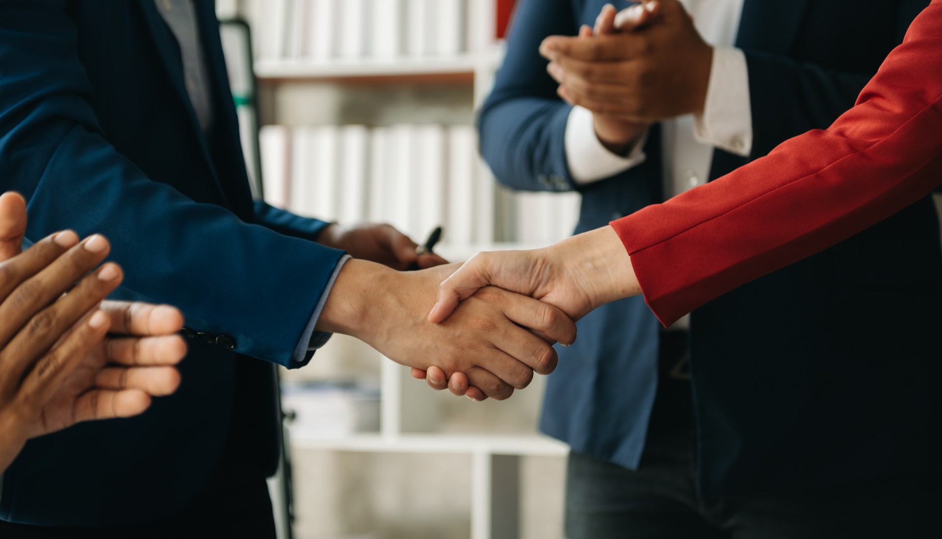 business people shaking hands during a meeting in office